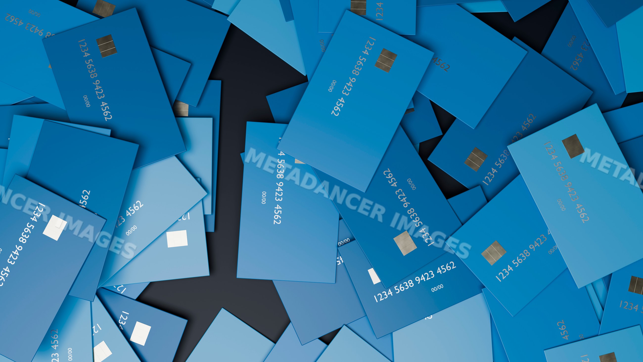 Multiple blue credit cards scattered on black background