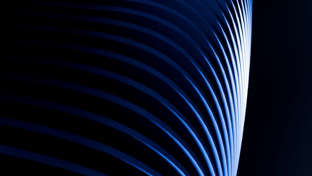 Abstract blue curved architectural sculpture with dynamic lighting
