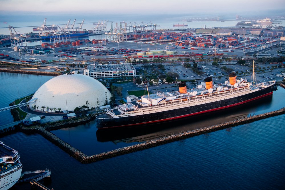 Historic ocean liner docked at the busy port of Long Beach, CA, USA