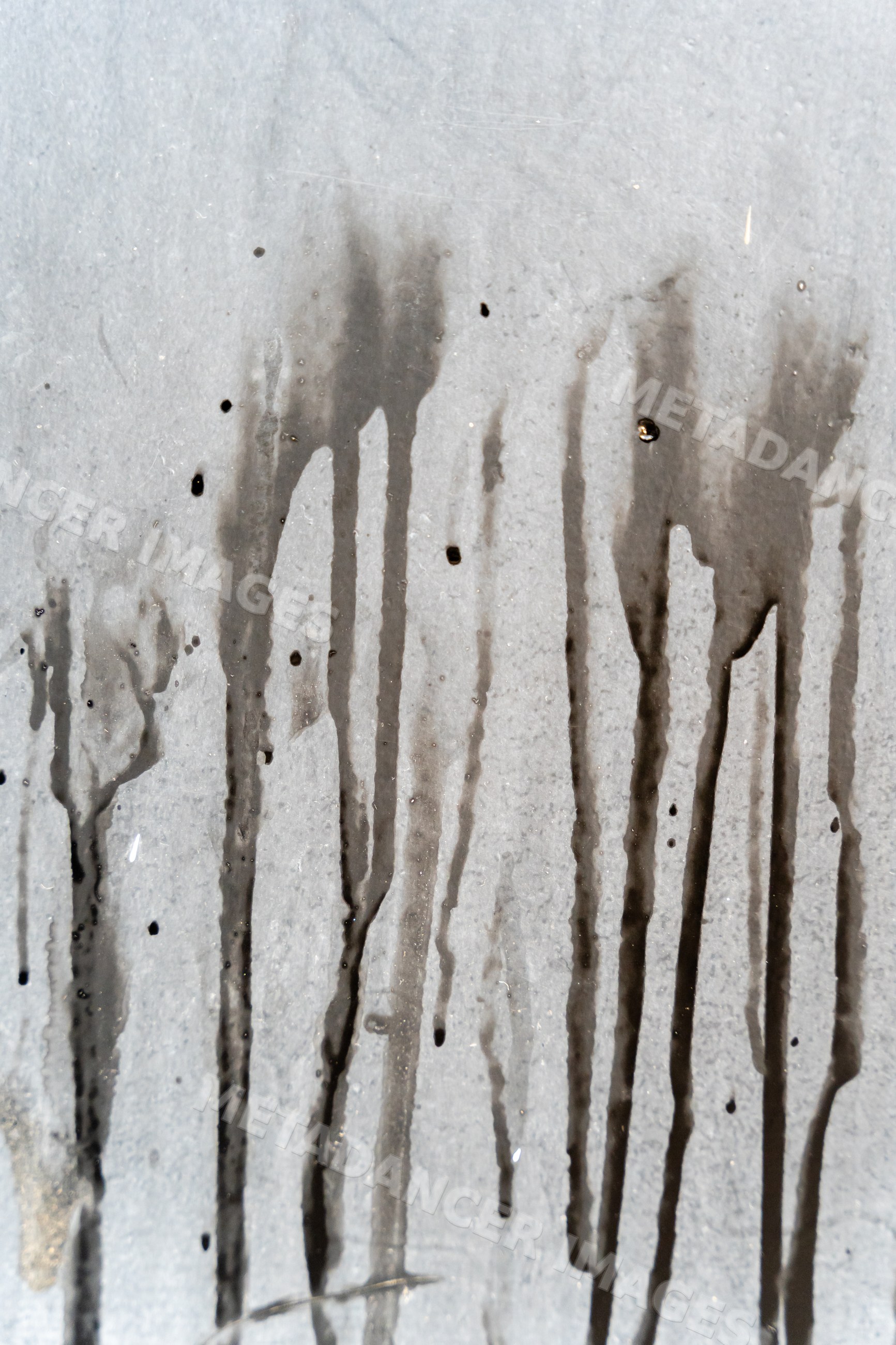 Abstract stains dripping on gray textured surface
