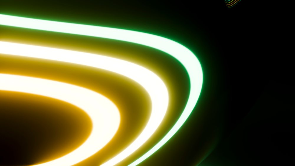 Abstract glowing neon light curves on dark background