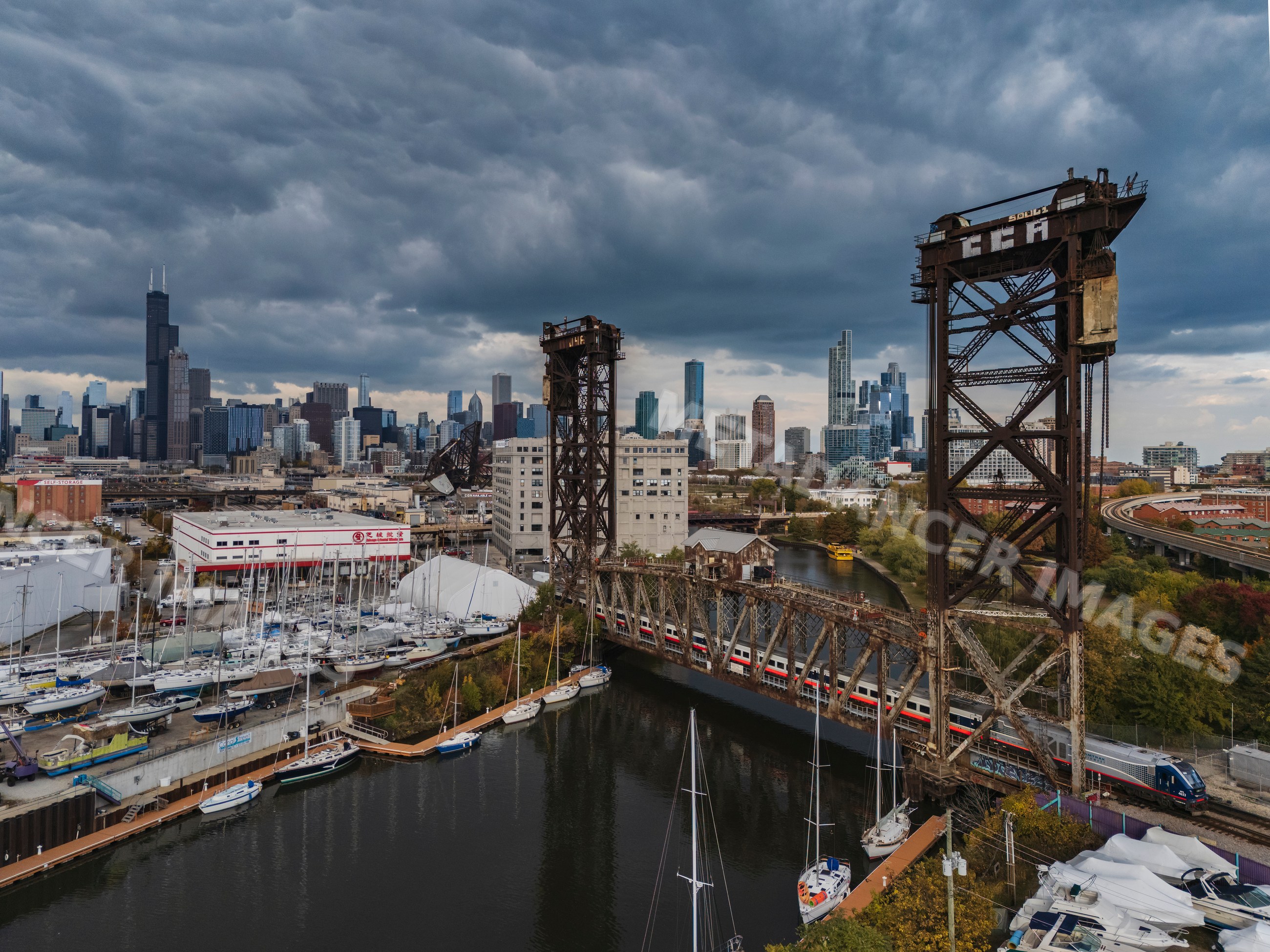 Canal street railway lift bridge with train and chicago skyline