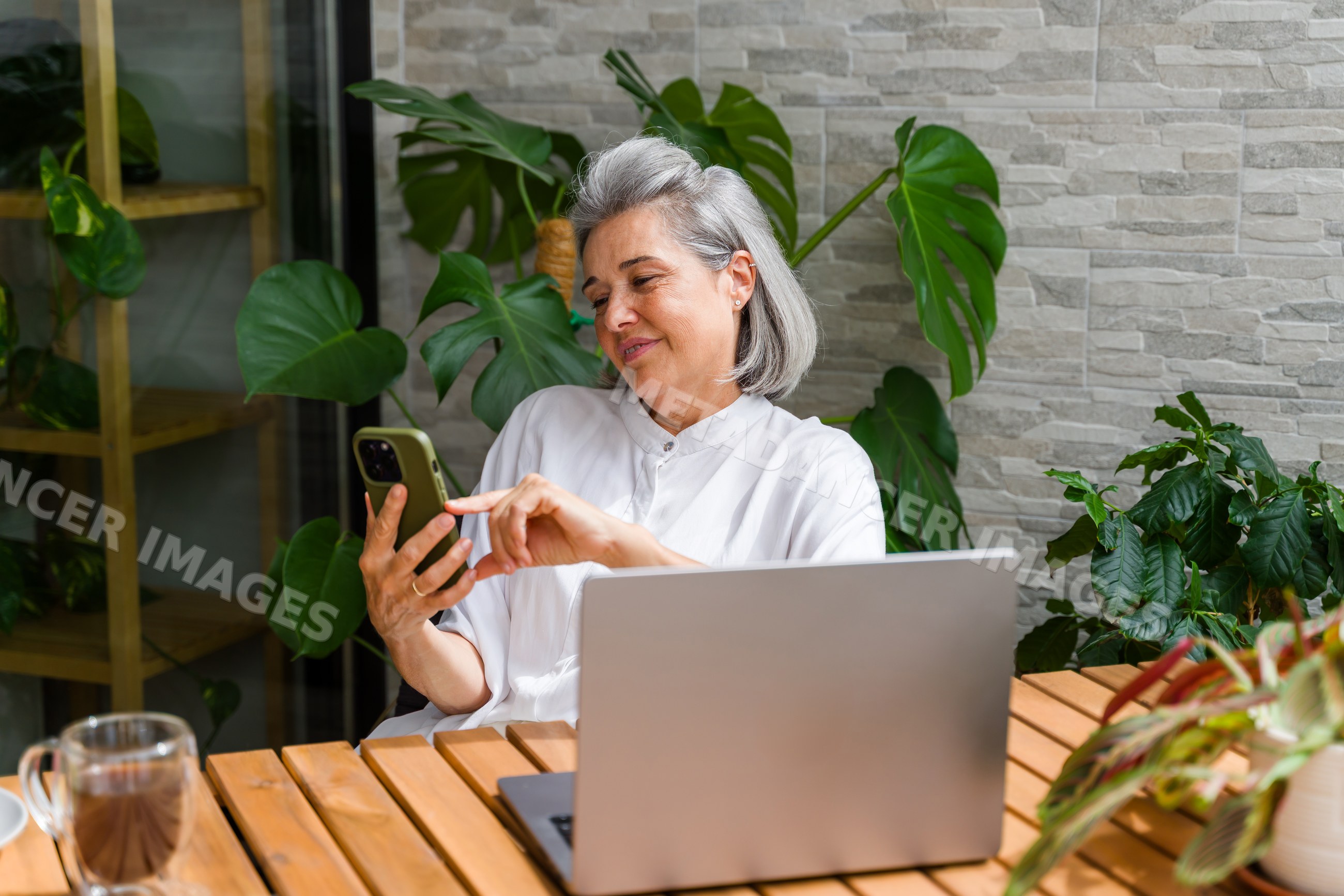 White Woman using smartphone sitting