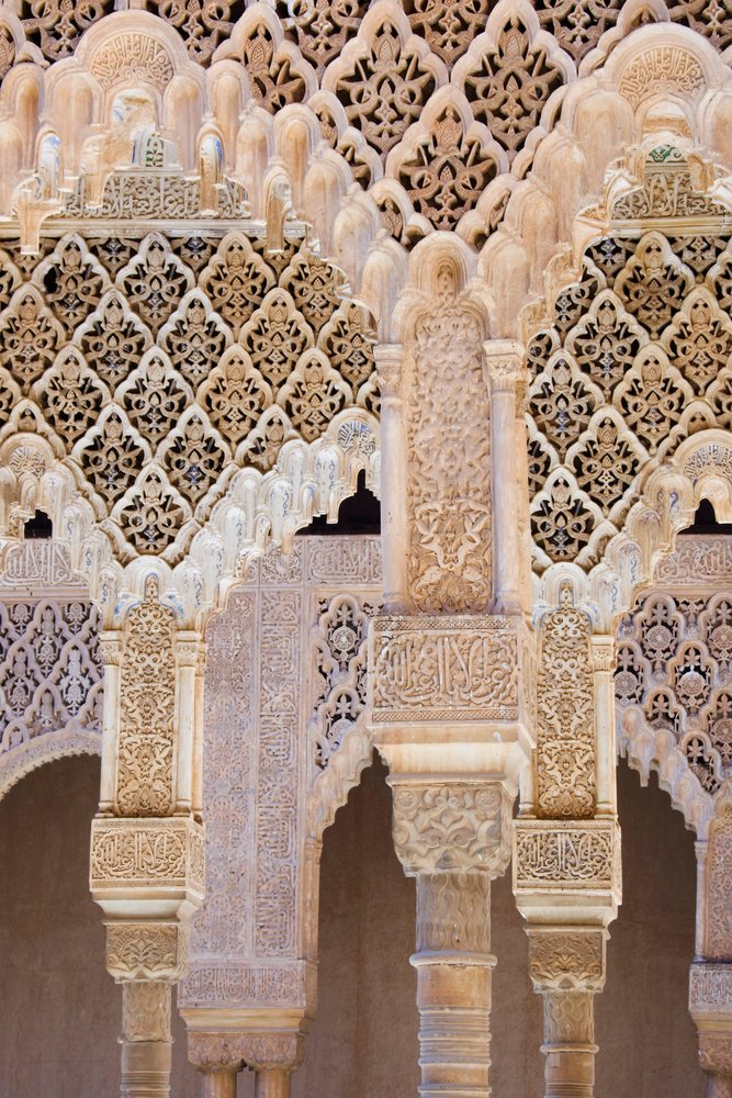 Ornate stone arches and columns at alhambra palace Spain
