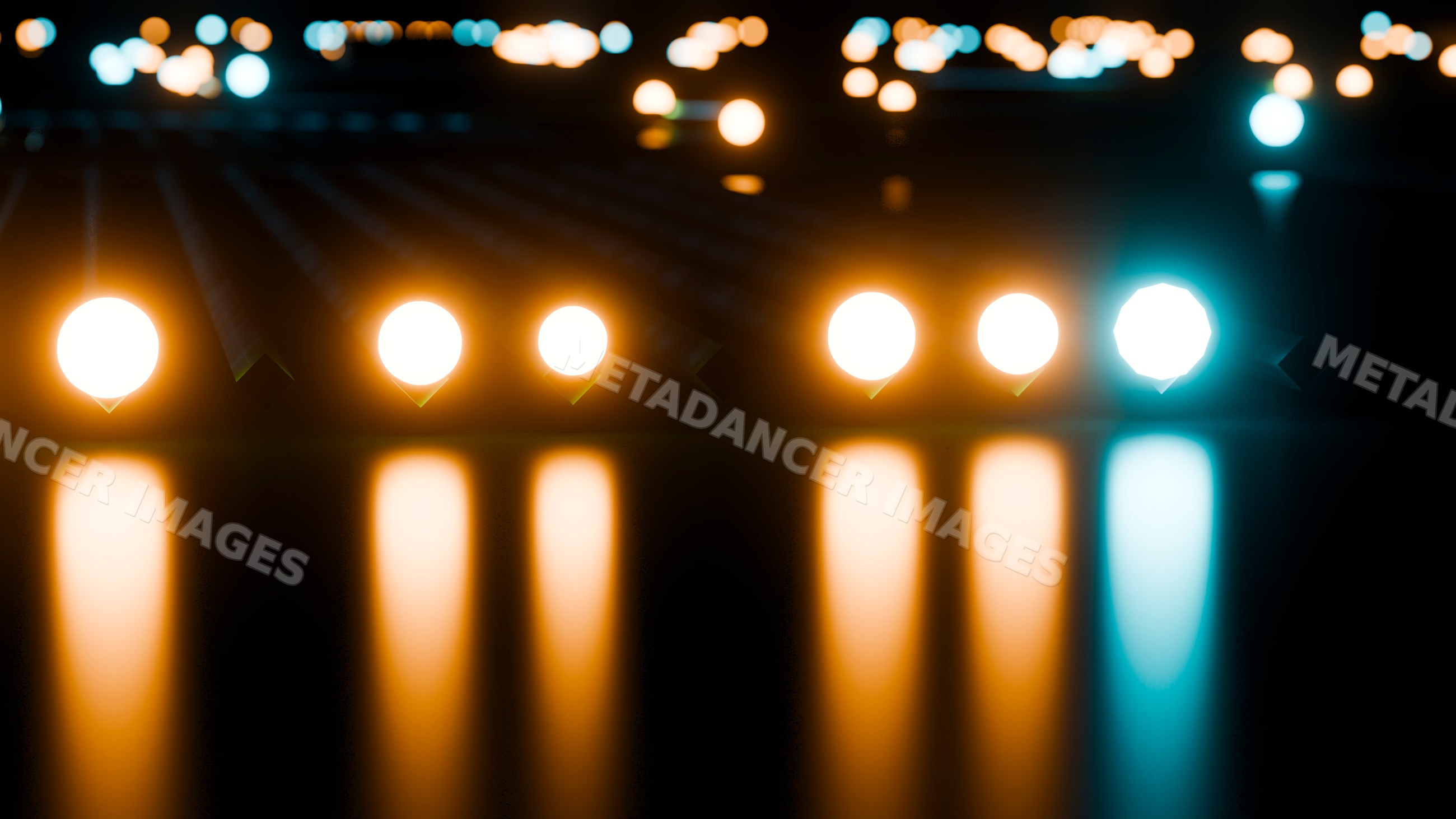 Glowing row of light bulbs reflecting on dark surface