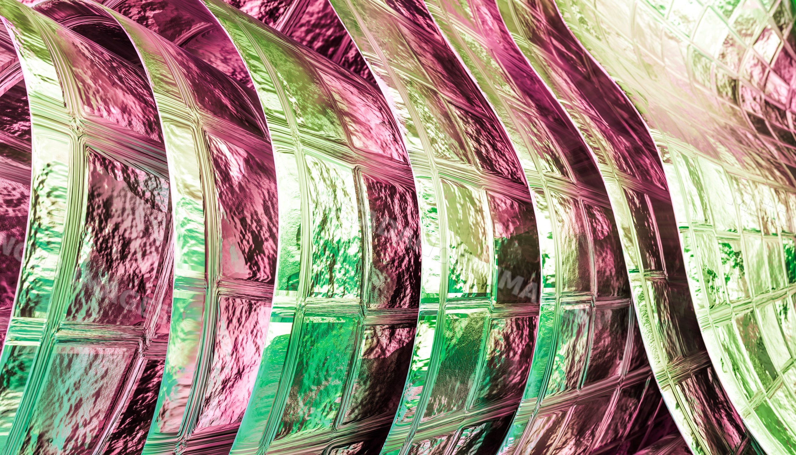 Curved decorative glass block wall with colorful textured surfaces