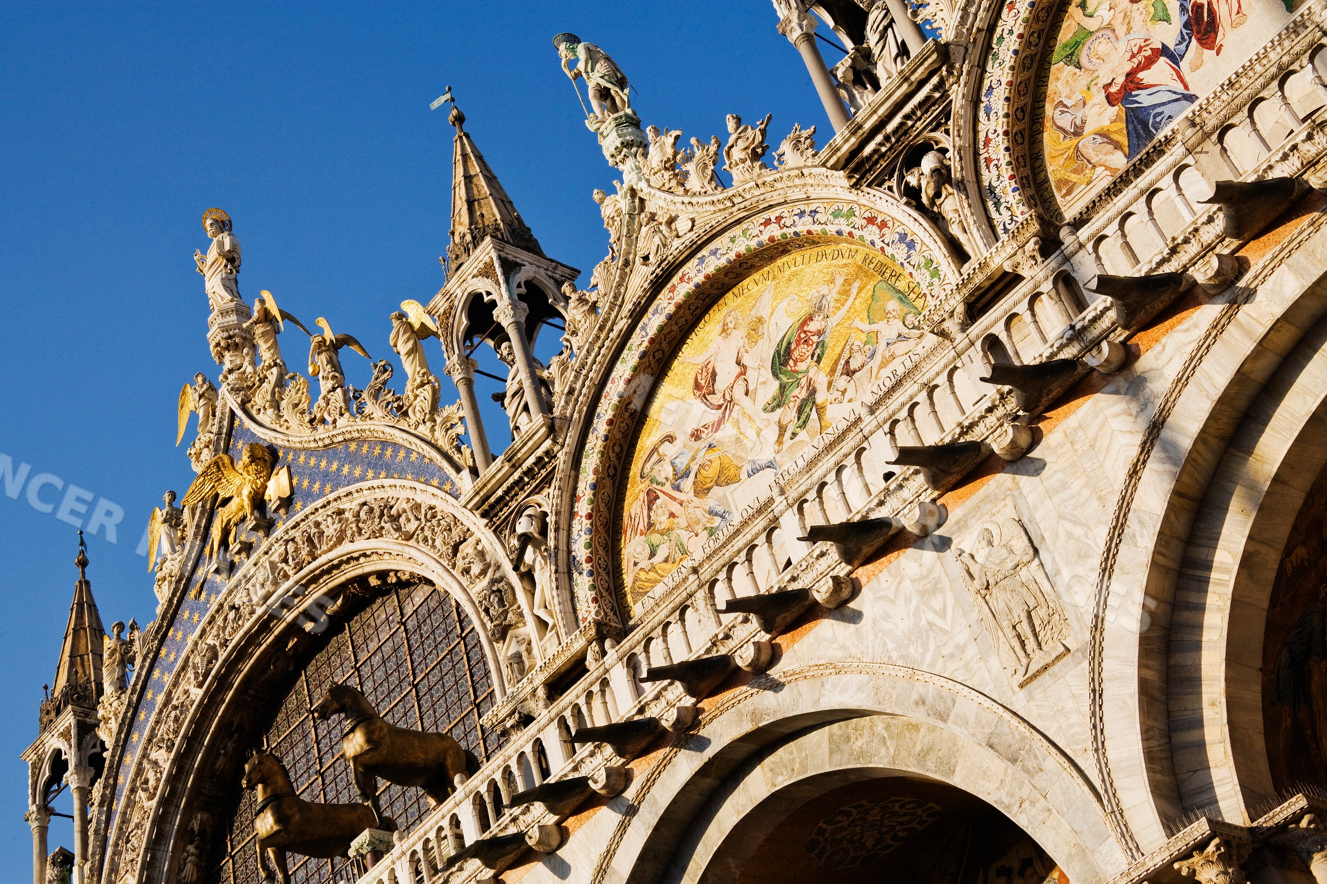St. mark's cathedral facade with statues and mosaics in venice, italy