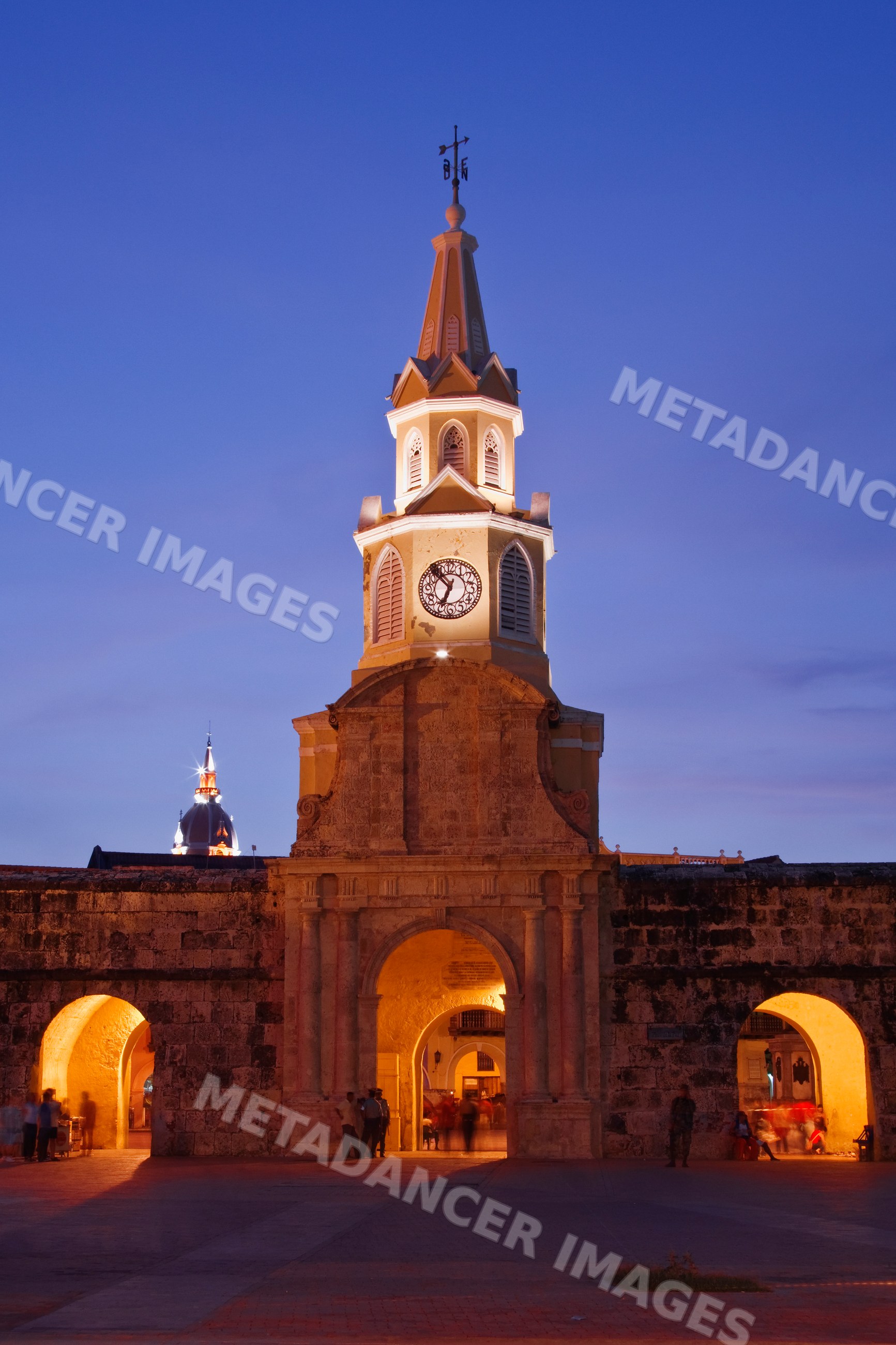 Puerta del reloj clock tower illuminated at night colombia