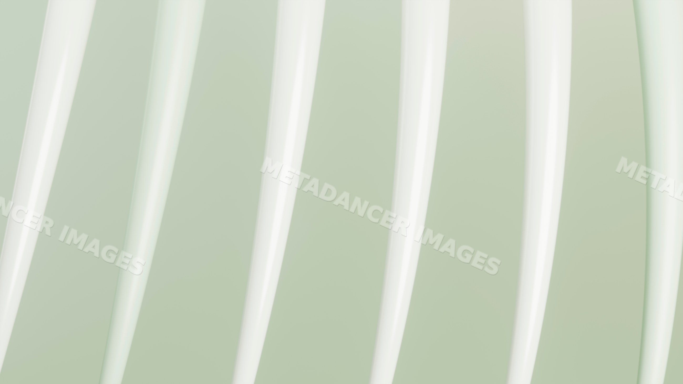 Close-up white fork prongs on soft green background