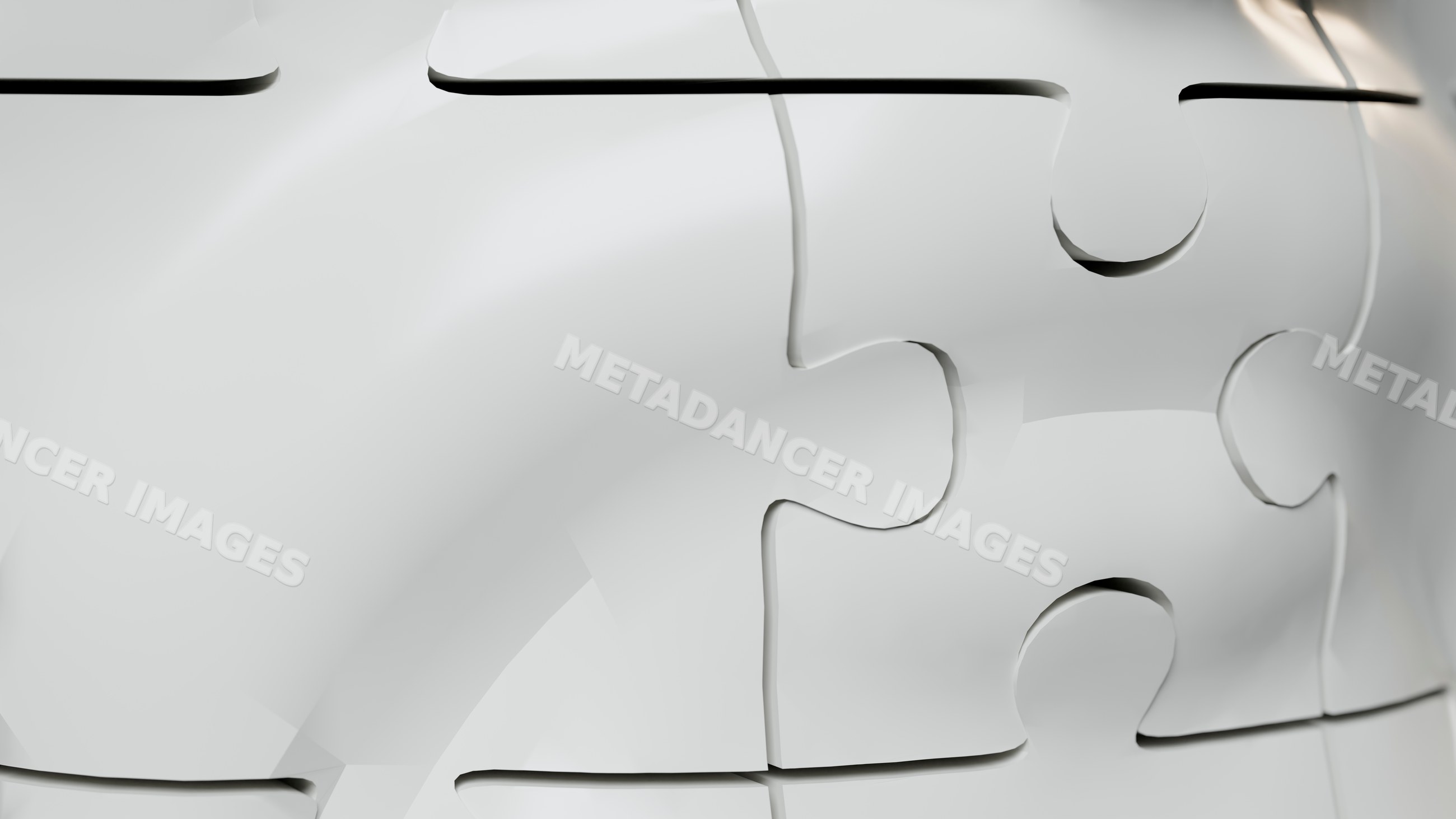 Close-up of interlocking white jigsaw puzzle pieces