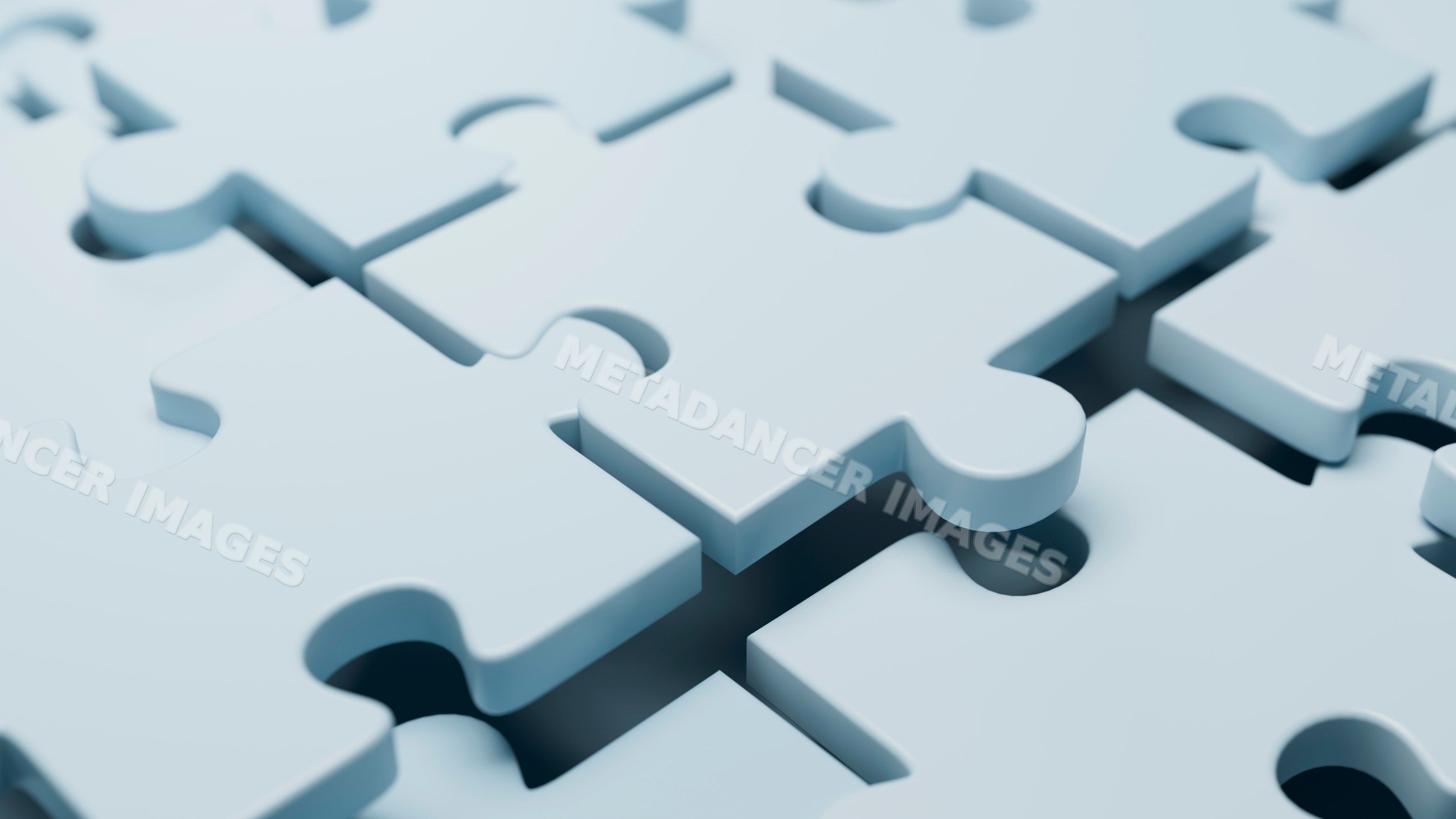 Close up of blue interlocking puzzle pieces