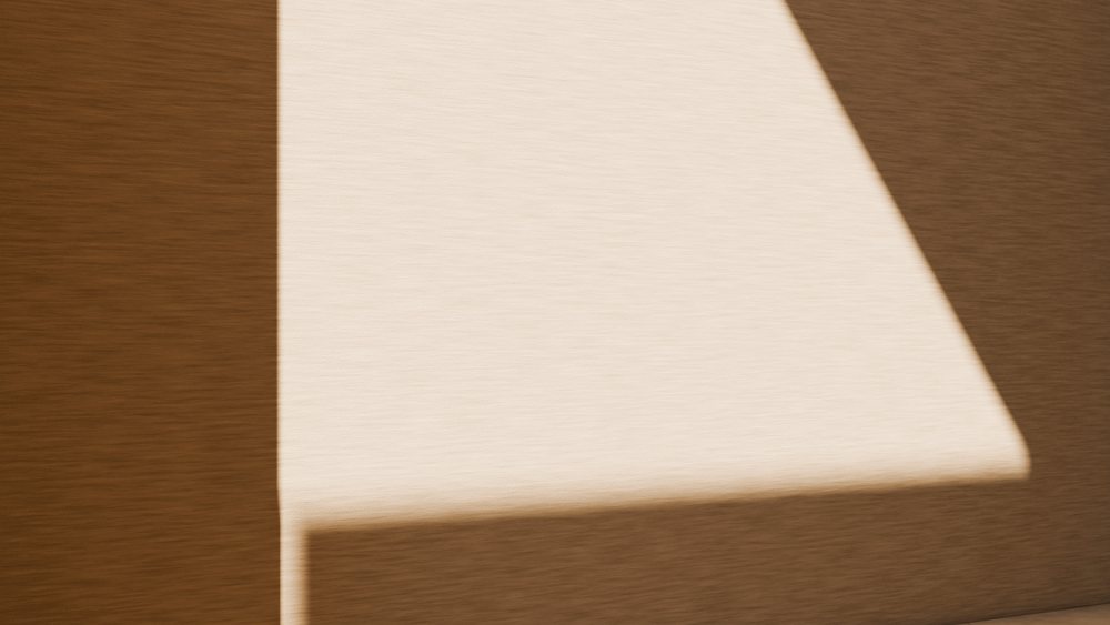 Abstract geometric shadow patterns on beige textured wall