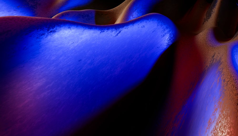 Close-up of a smooth metallic surface with abstract blue shapes