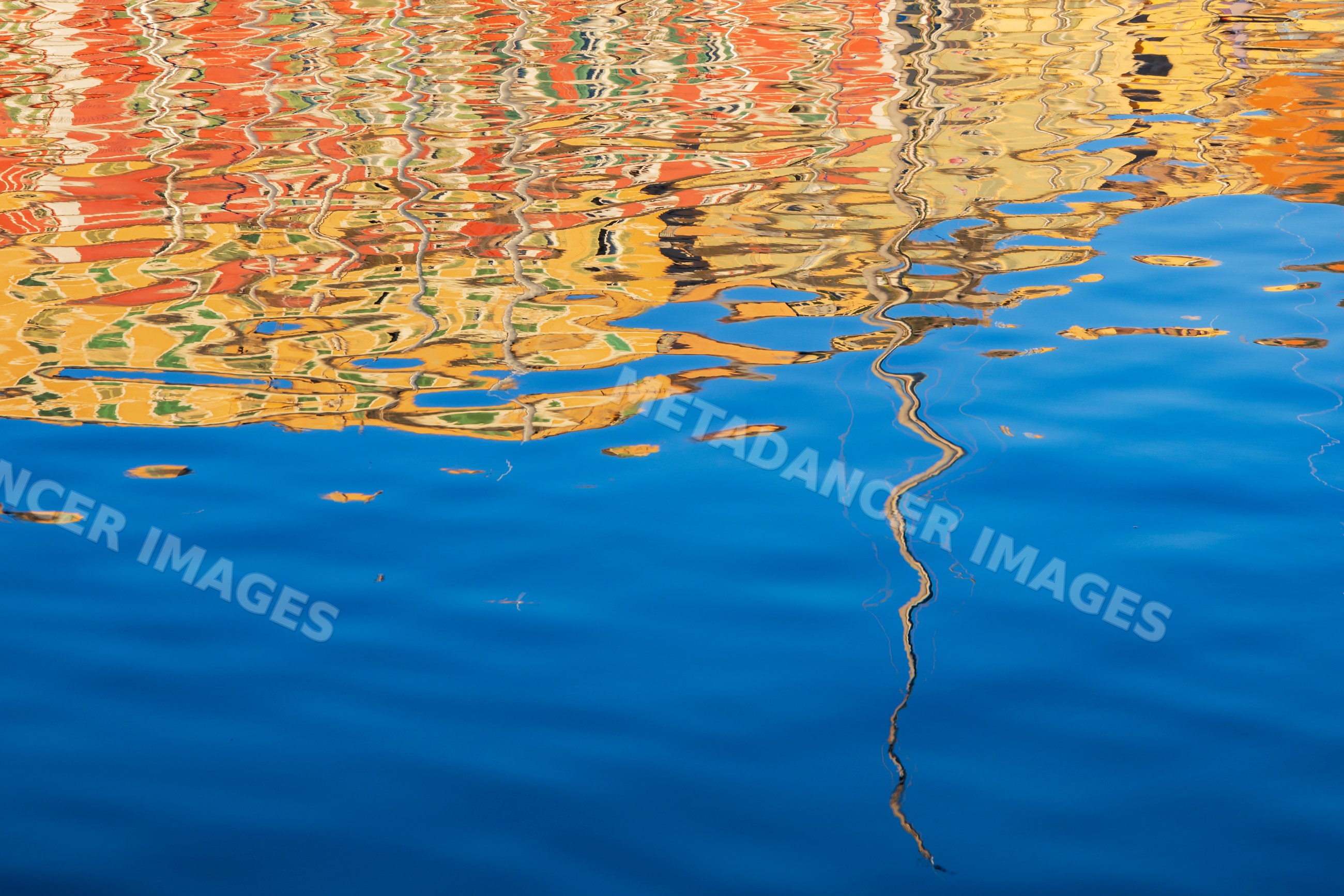 Ripples and colorful Reflections on water in bastia corsica
