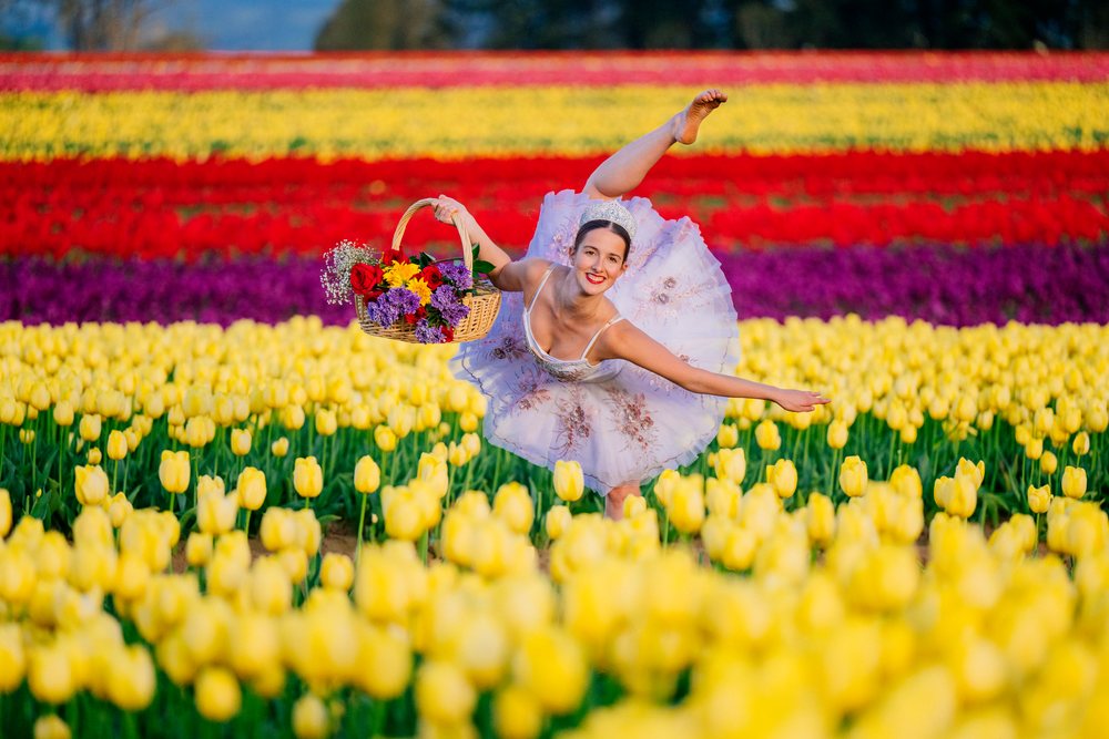 Ballet white dancer balancing with flower basket