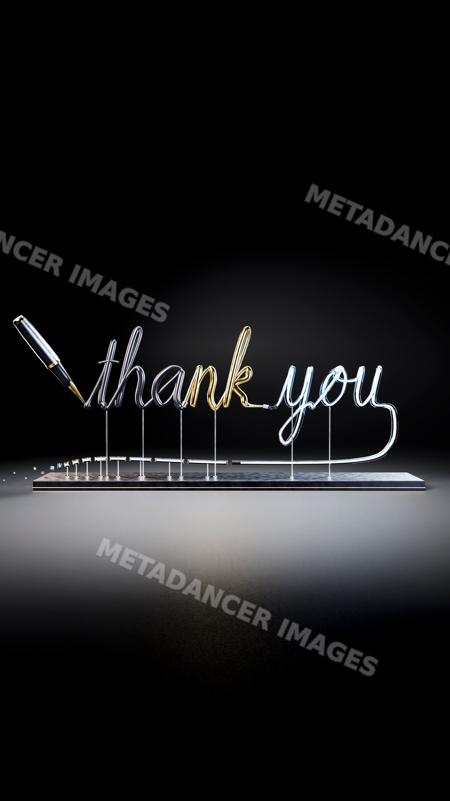 Metallic thank you text written with fountain pen on metal base