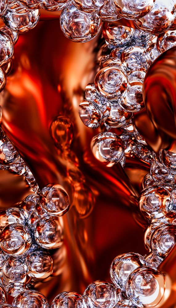 Transparent glass bubbles clustered amid flowing red and orange liquid