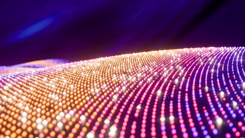 Glowing colorful dots forming digital wave pattern illustration