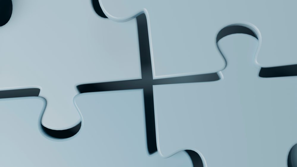 Close-up illustration of blue interlocking puzzle pieces