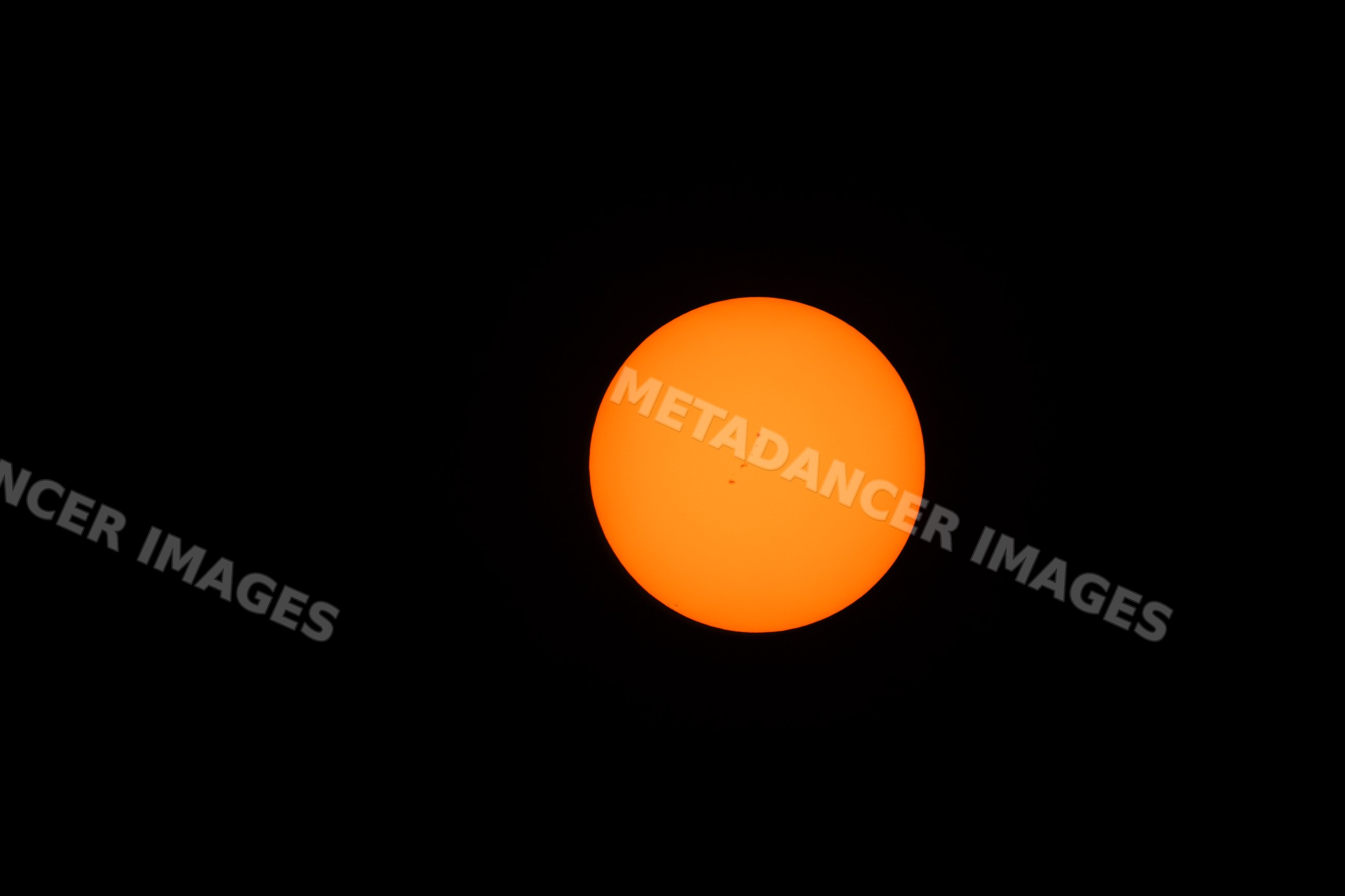 Sun with visible sunspots during eclipse in Los Angeles, USA