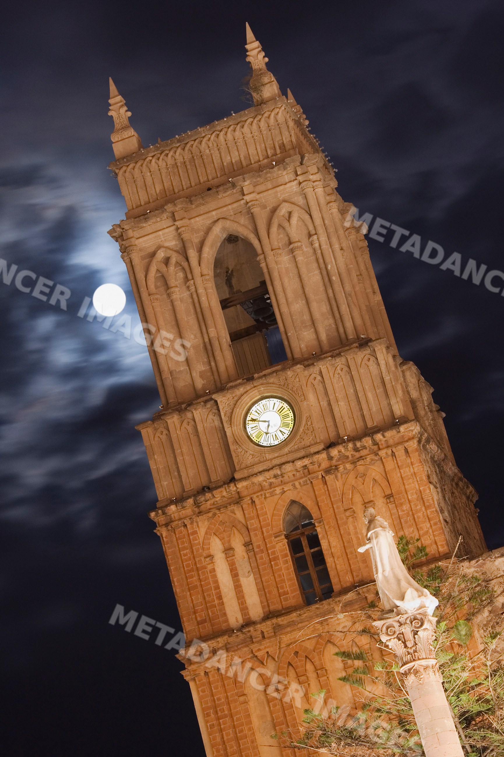 Clock tower illuminated at night mexico
