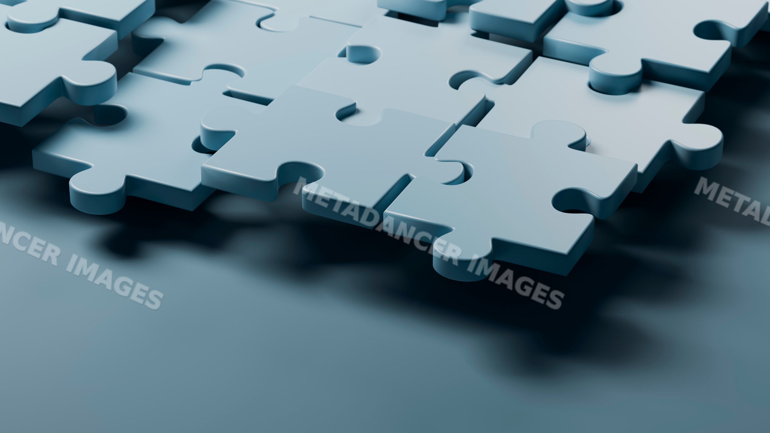 Blue 3d puzzle pieces fitting together in close-up