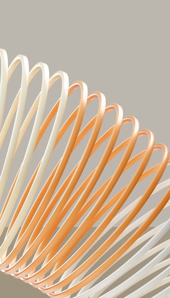 Abstract sculpture of looping orange and cream ribbons