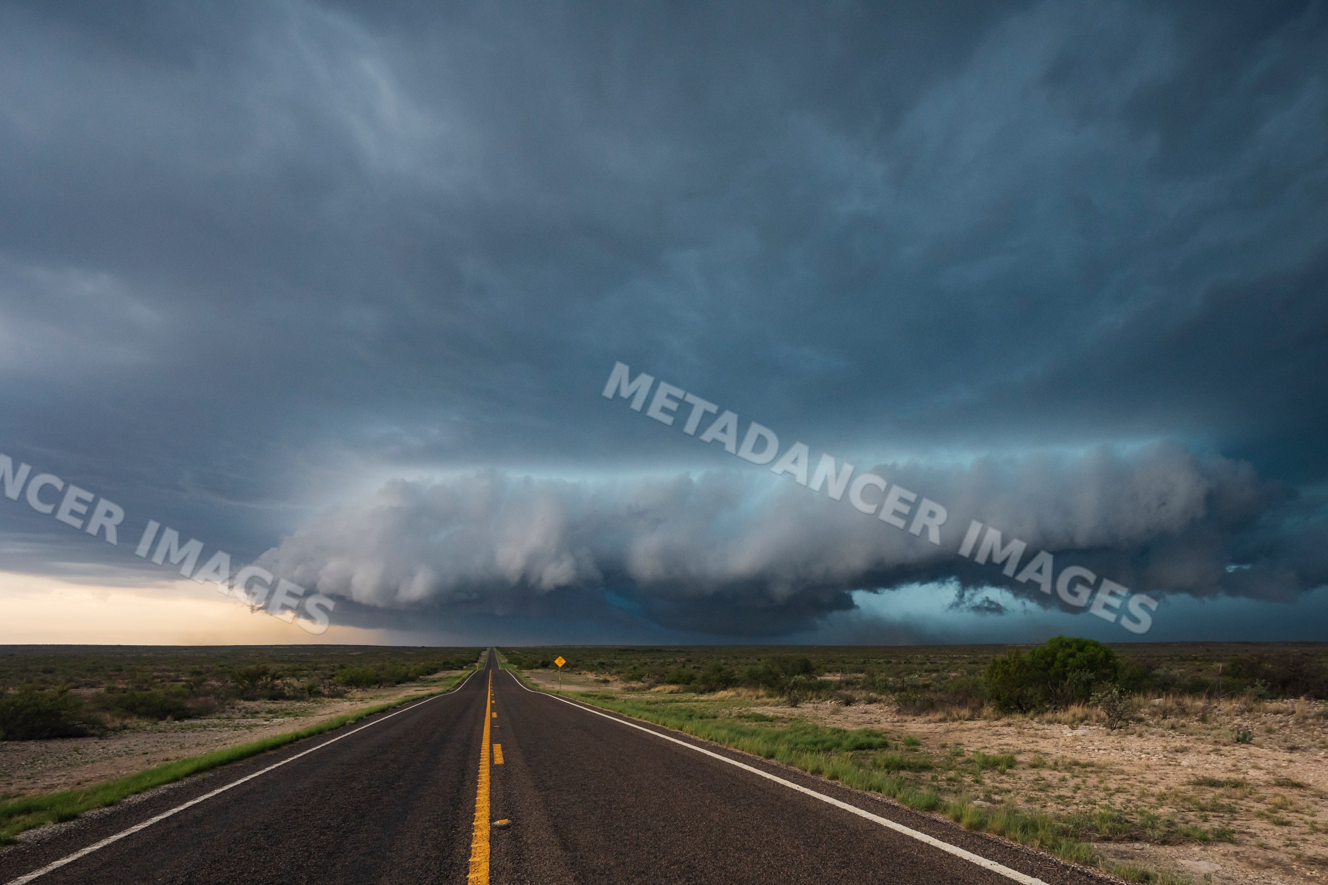 Mesocyclone storm cloud over road in dryden, texas
