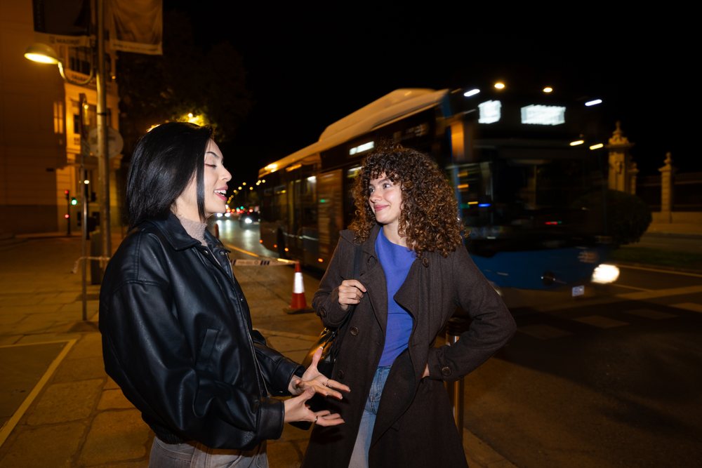 Two Hispanic and white women talking on a Madrid street