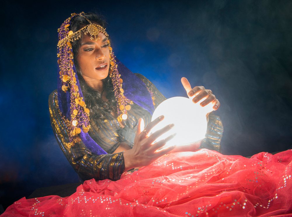 A South Asian woman fortune teller gazes