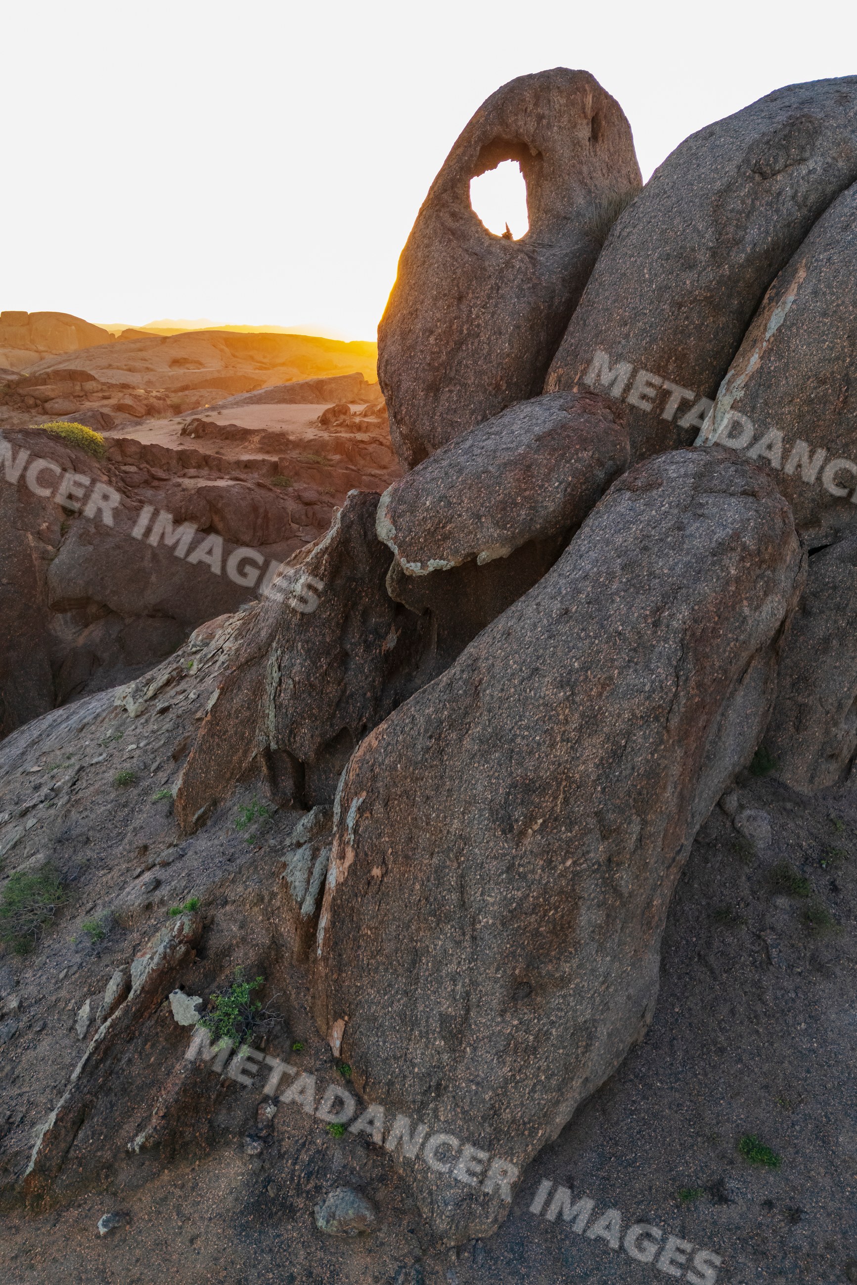 Rock window formation at sunset in stone valley, the bear, Namibia