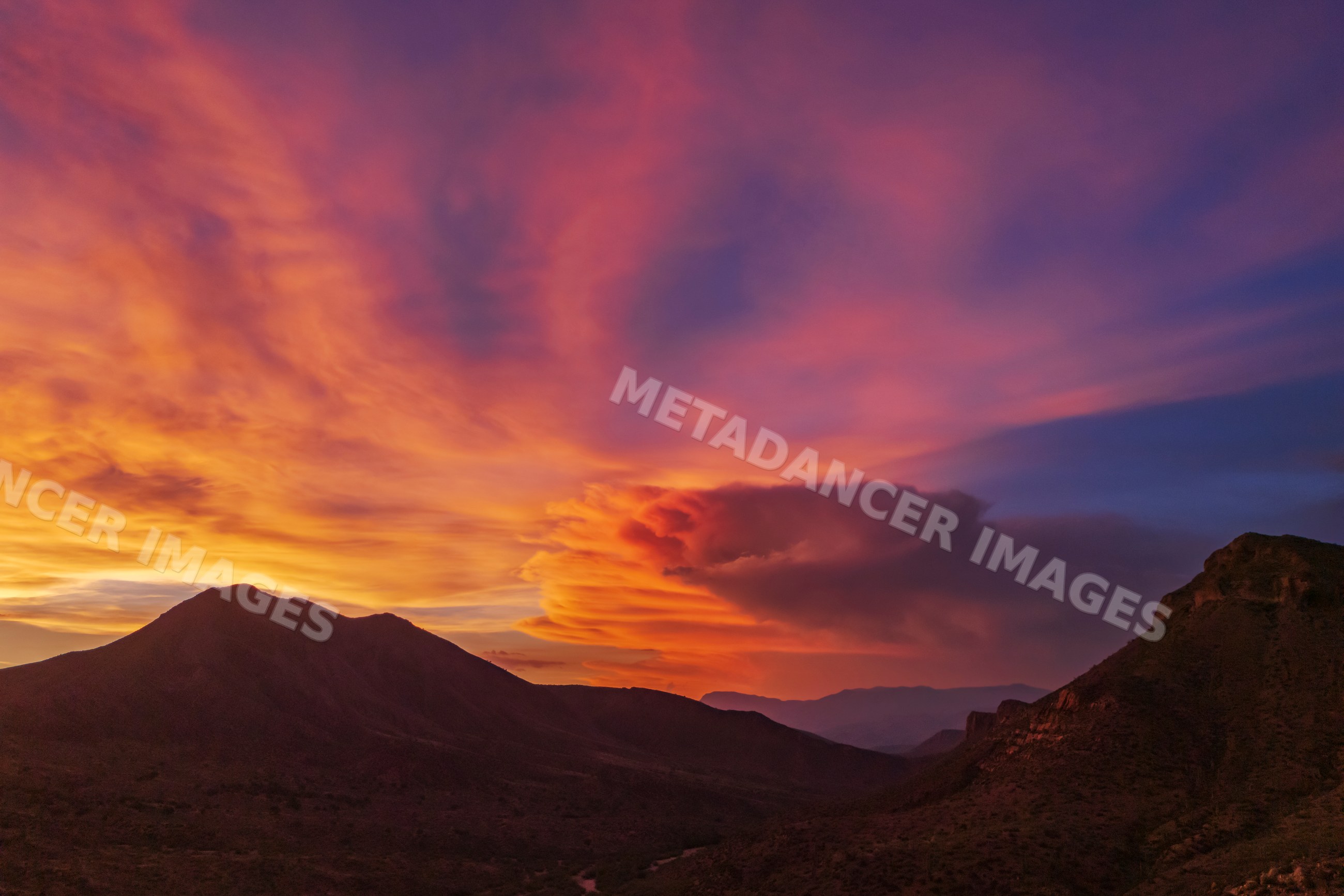 Thunderstorm at Sunset over globe mountains