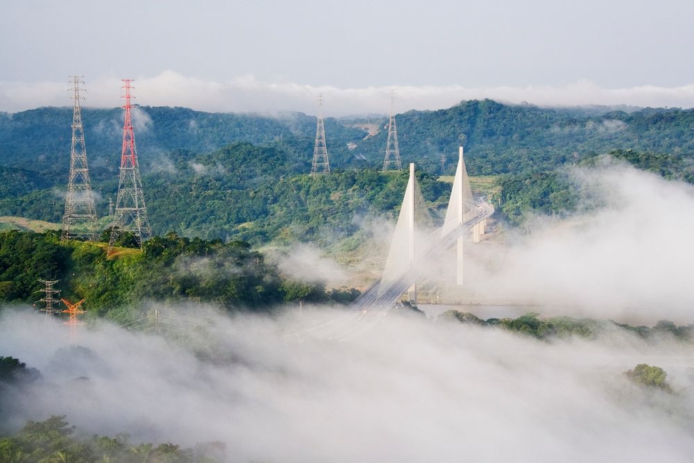 New millennium panama canal bridge over misty lush hills