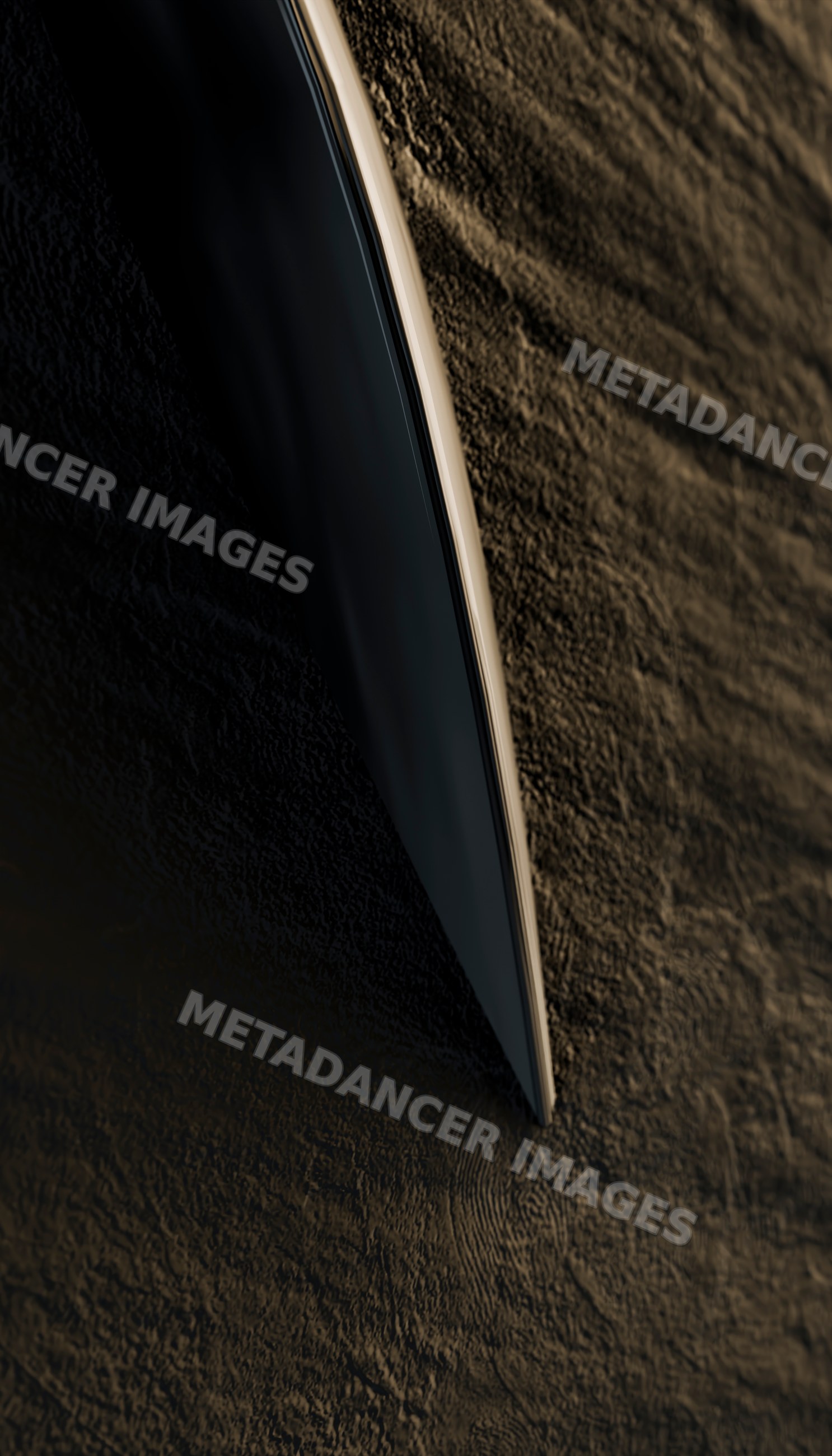 Boat hull cutting through dark water surface at night
