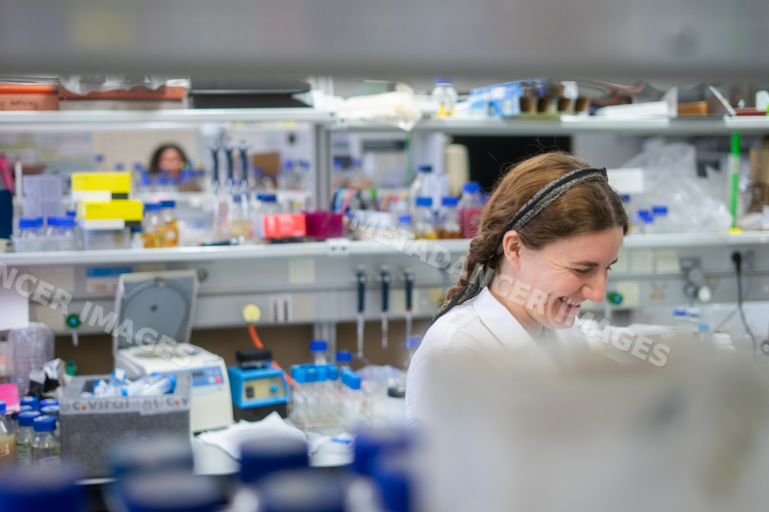 Scientist working in research laboratory with scientific equipment