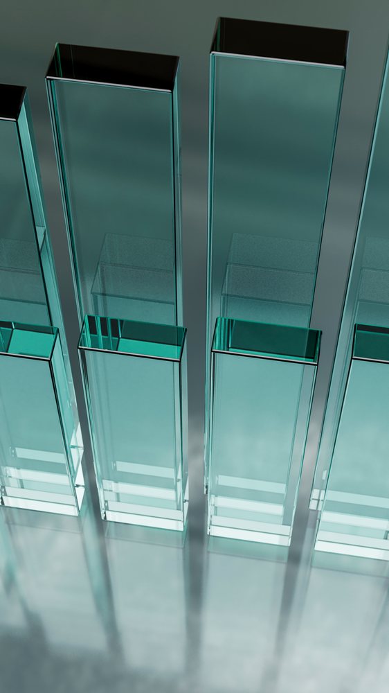 Transparent glass pillars on reflective surface in modern design