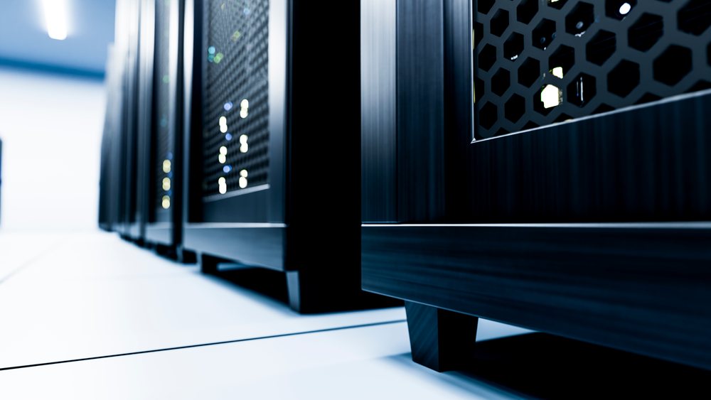 Server racks with ventilated black panels in data center