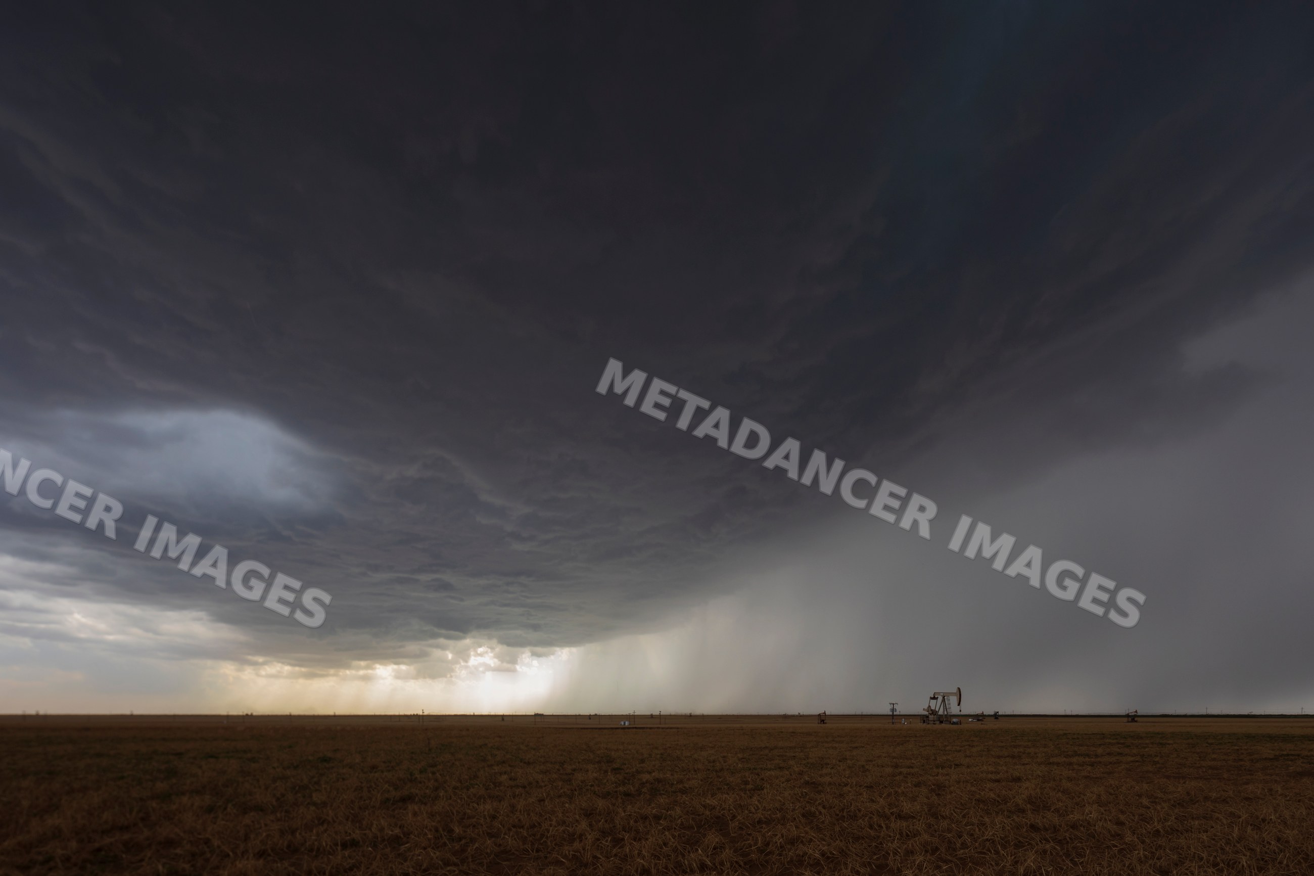 Supercell thunderstorm forming over oil fields in morton, texas