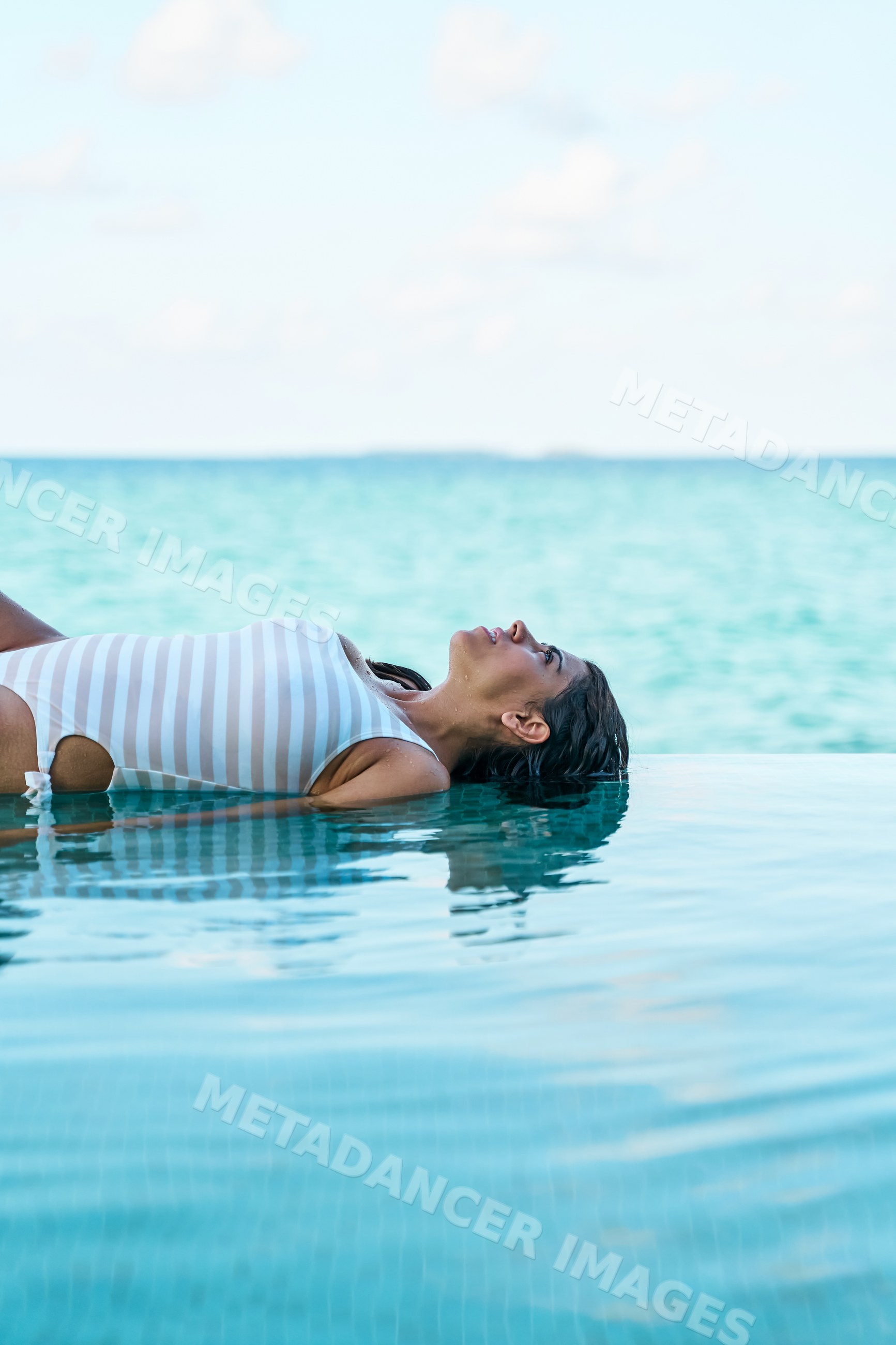 A white woman floats peacefully