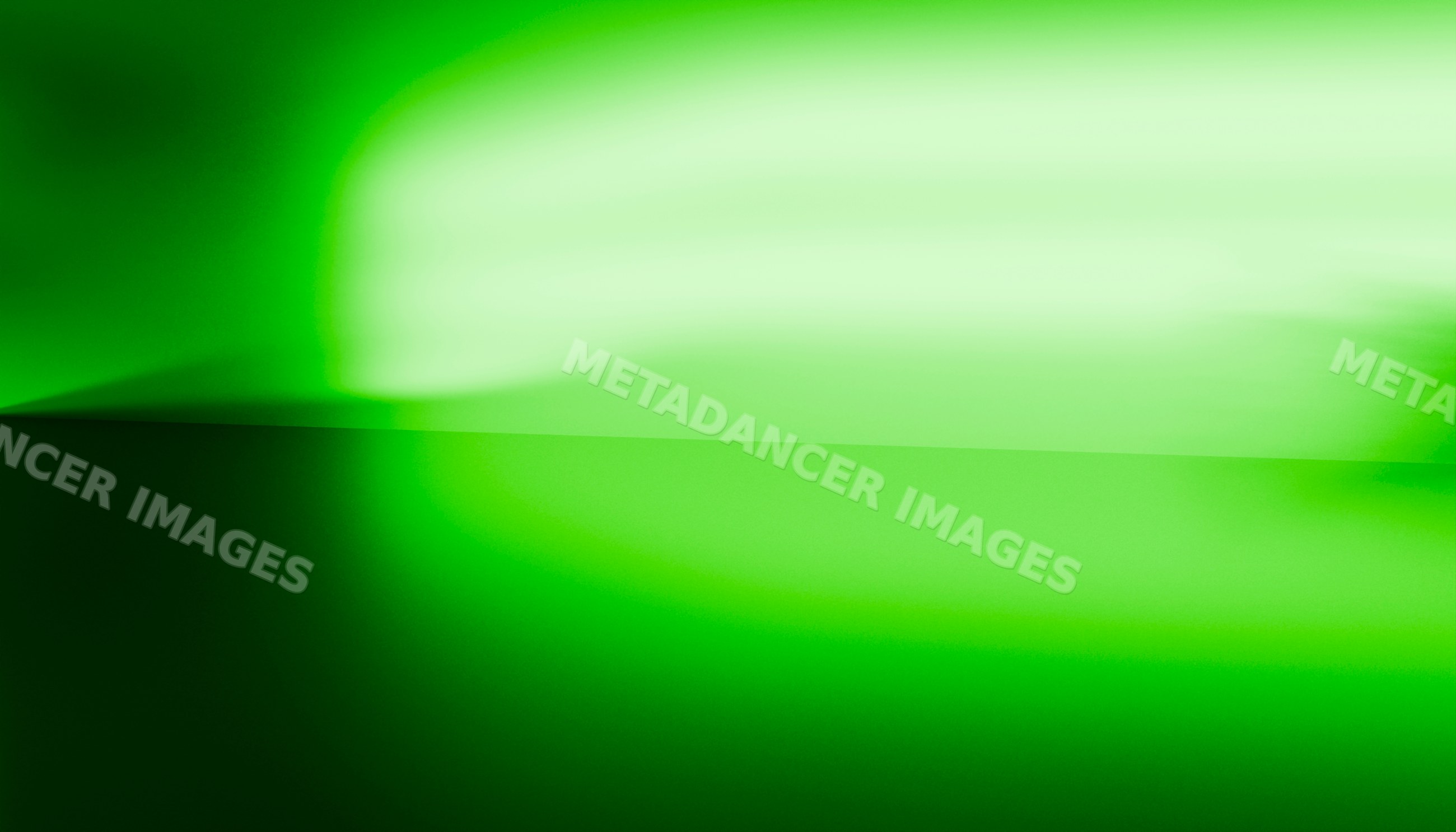 Abstract green light and shadow gradient on interior wall corner