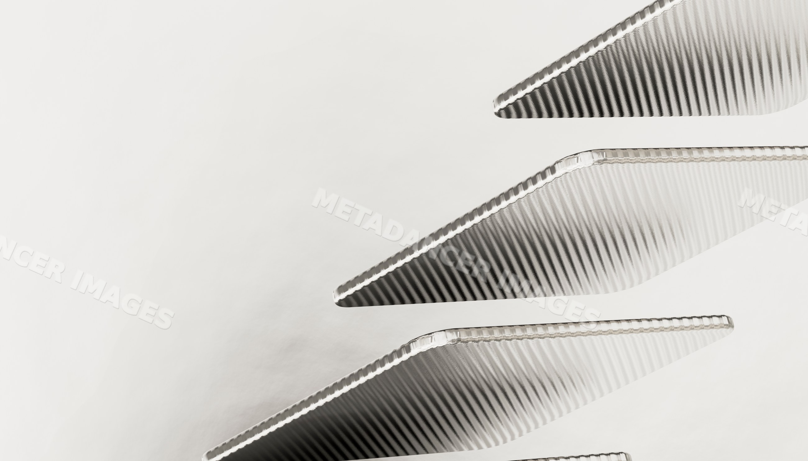 Close-up of parallel metallic triangular objects with textured