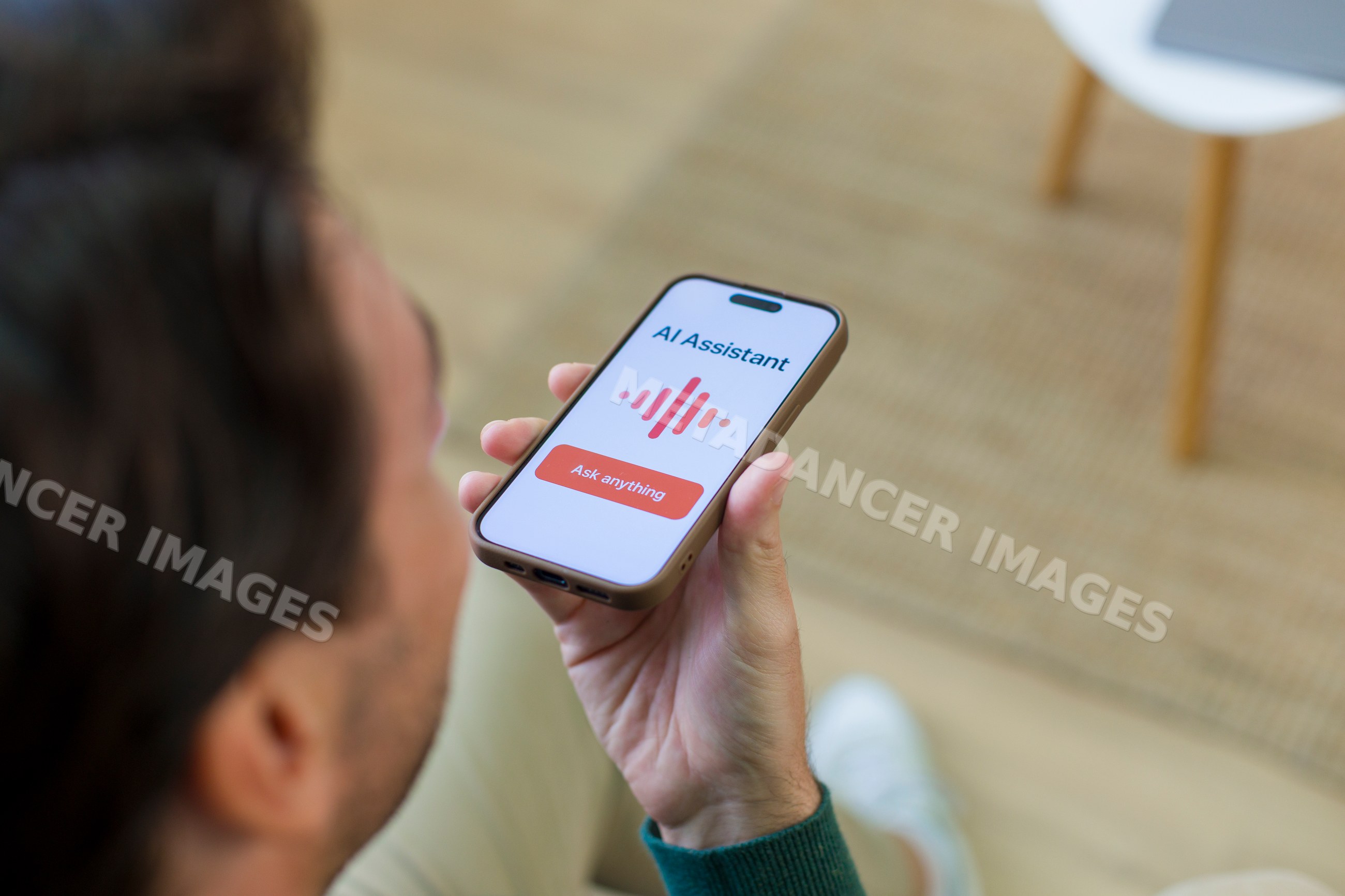 White person using ai assistant app on smartphone at home