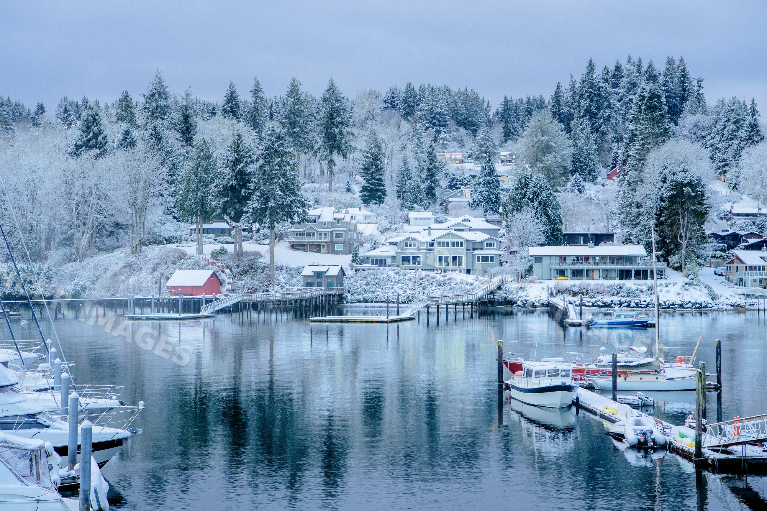 Snow-covered marina with boats and docks in WA, USA winter