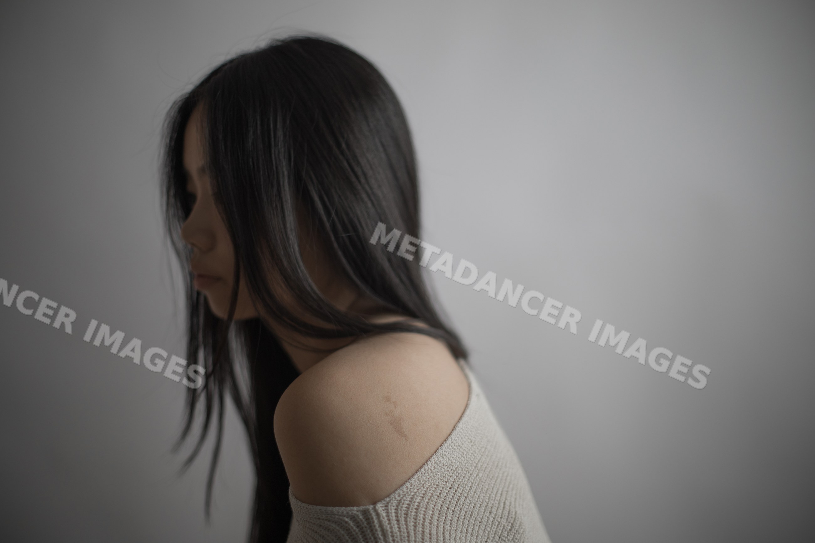 Thoughtful Southeast Asian woman portrait with long black hair