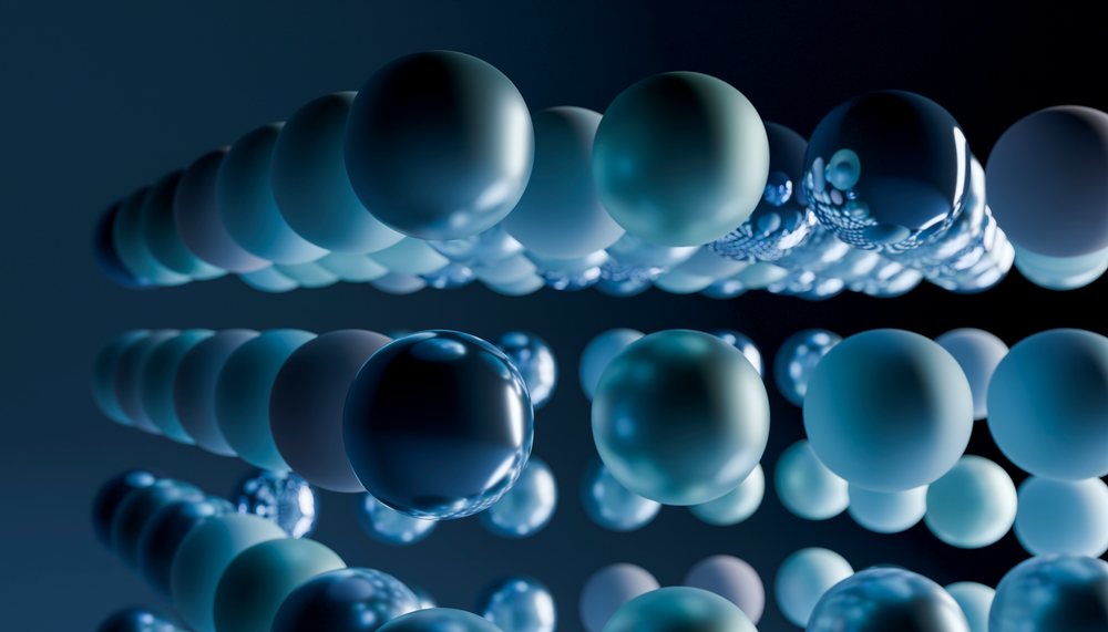 Floating blue spheres form an abstract geometric pattern on dark
