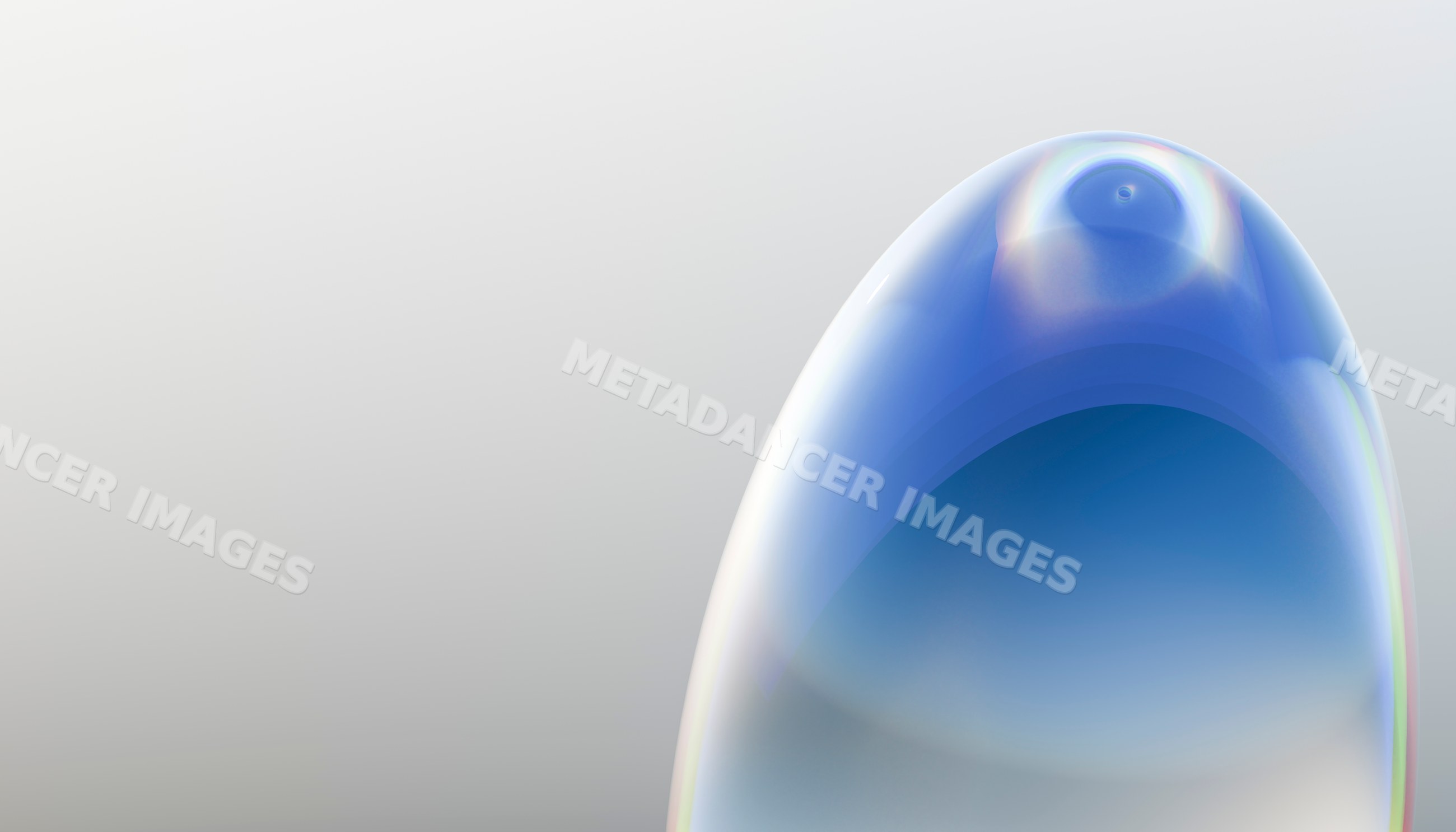 Close up of a shiny transparent bubble with colorful reflections
