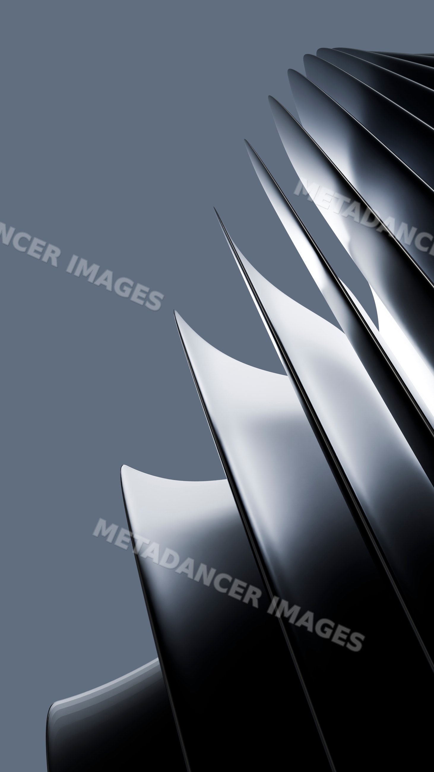 Close-up of shiny metal turbine blades with curved edges