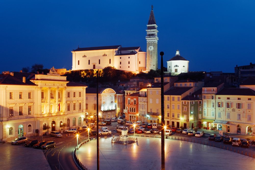Town of piran with illuminated historic buildings