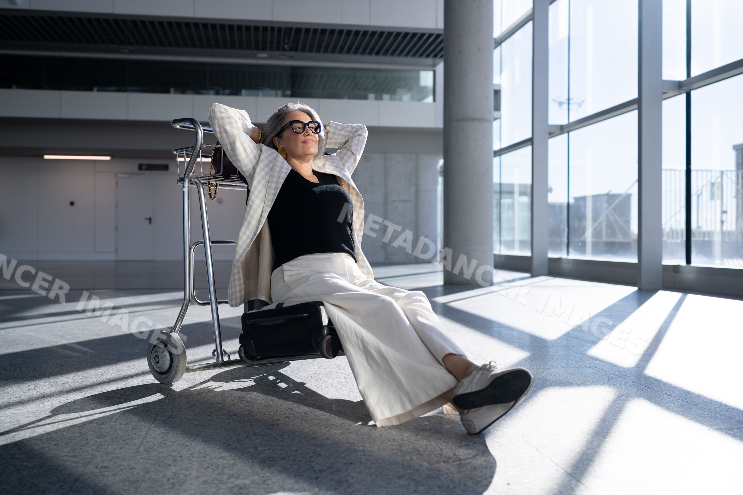 Mature white woman relaxing on cart