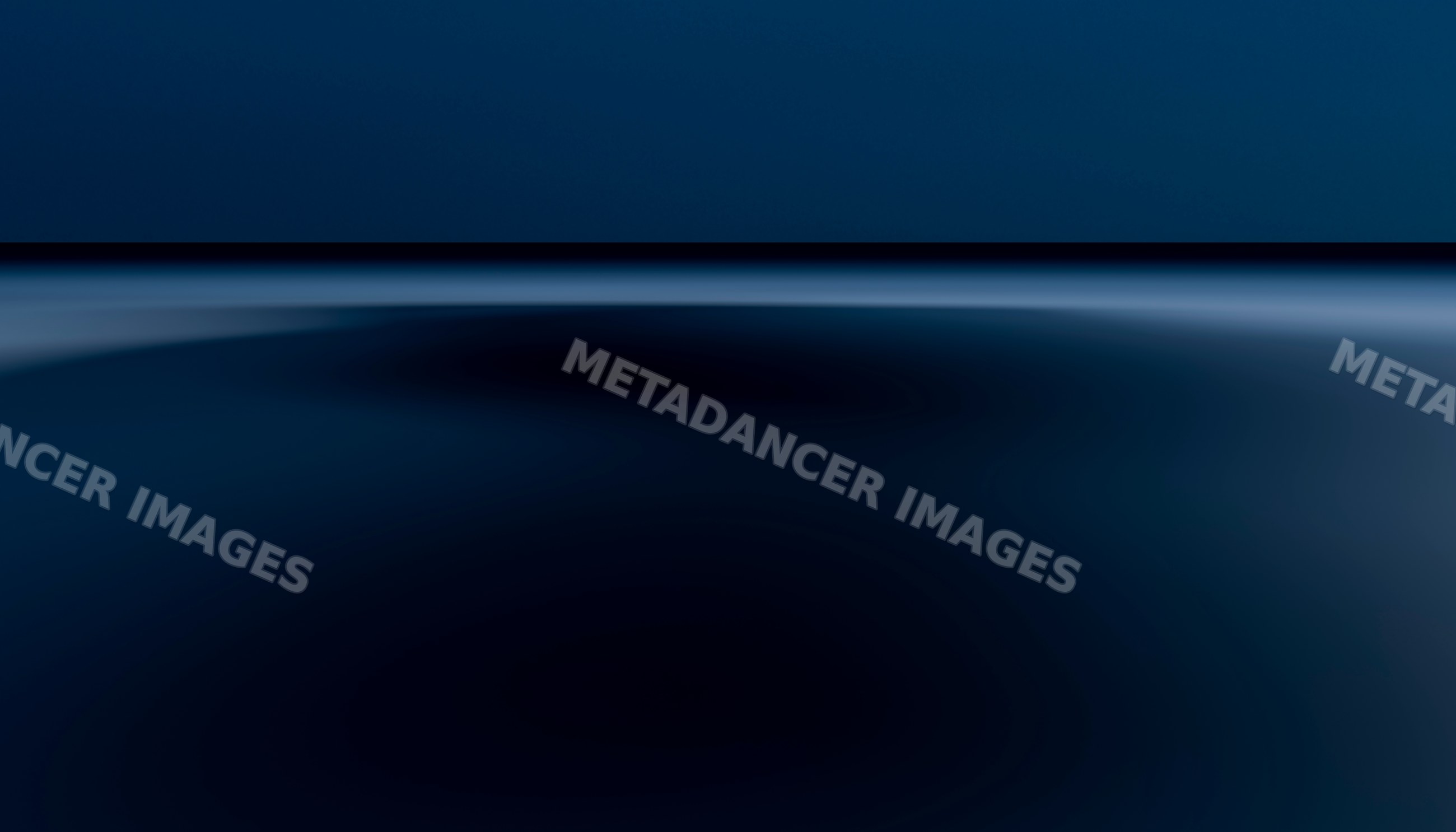 Calm ocean water at night with clear horizon